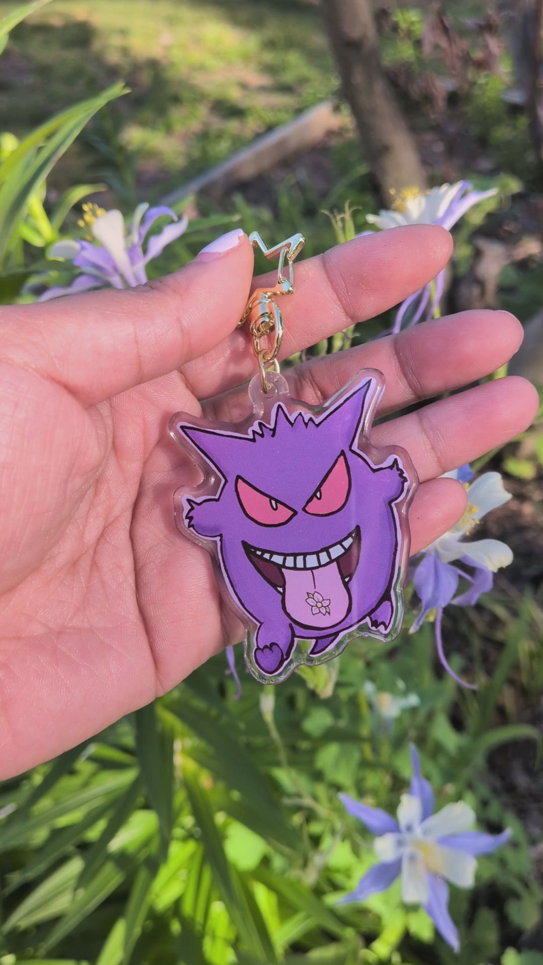 gengar keychain held in hand